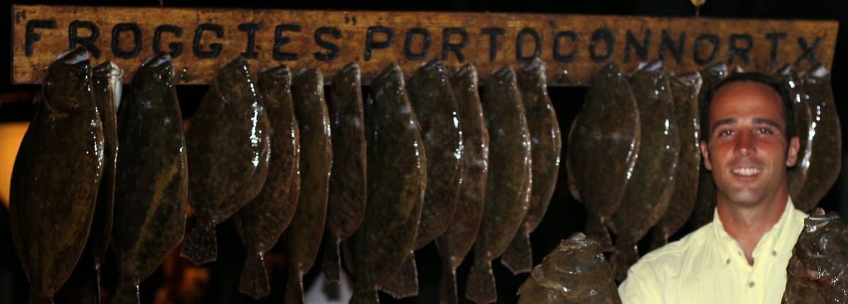 A full stringer of flounder under the Froggies Port O'Connor TX sign